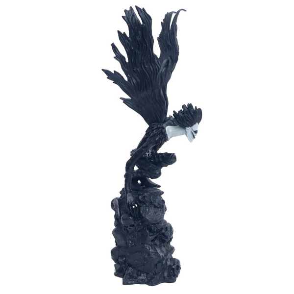 Figurine Ryuk sur une montagne de crânes